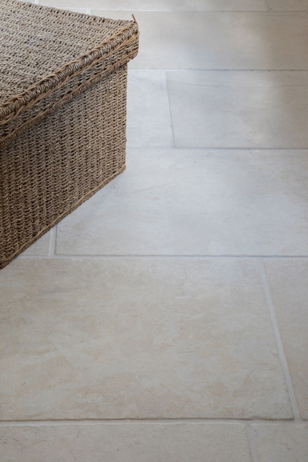 What are the orange marks in natural stone flooring?